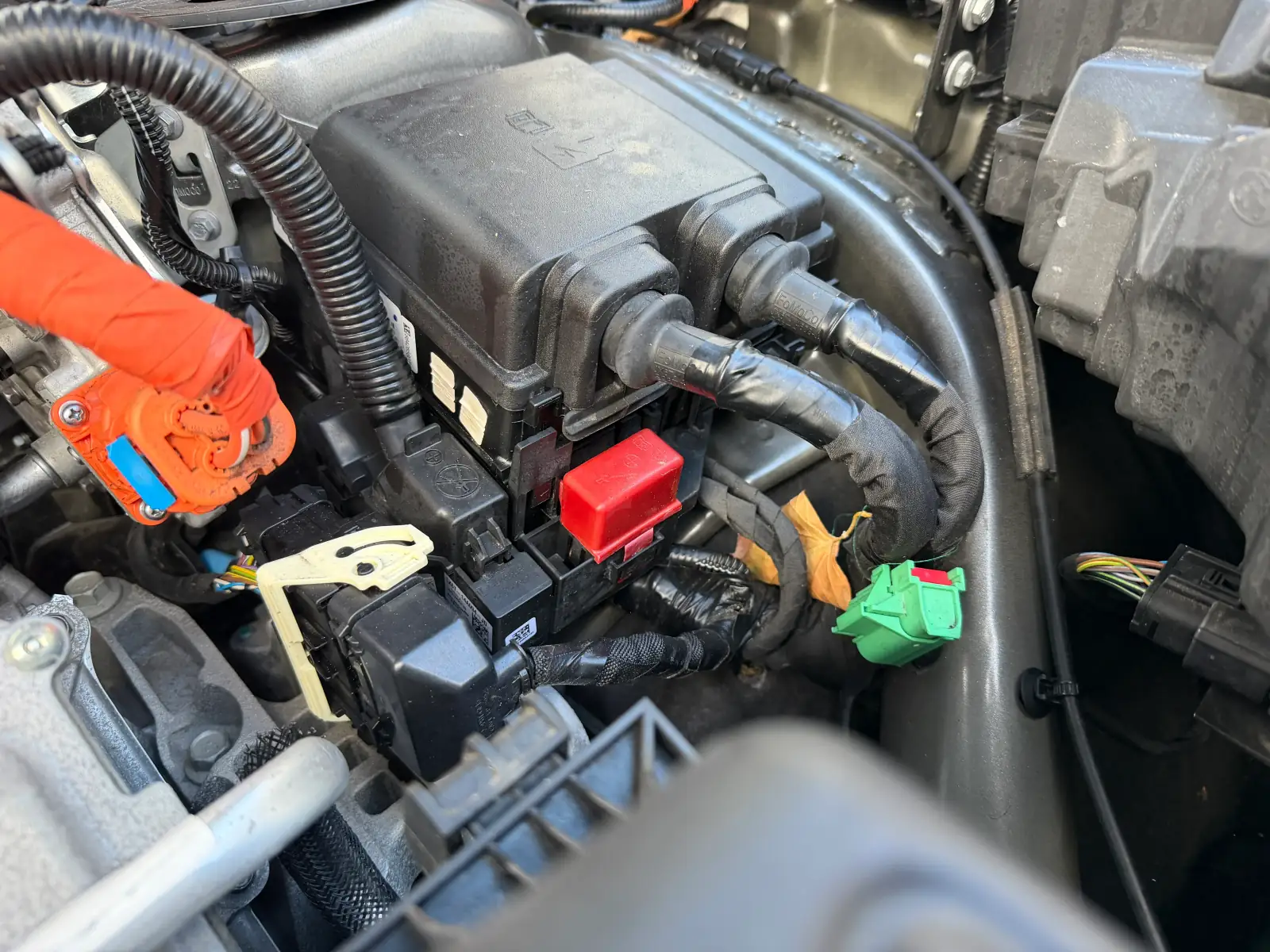 Jump starting a car with jump leads showing correct cable connections
